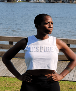 Maya at the waterfront wearing an INSPIRE crop top